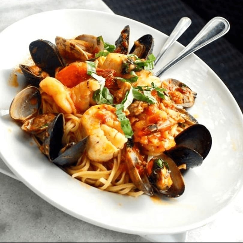 Tre Scalini's linguine with shrimp, mussels, clams, and basil in a red sauce.